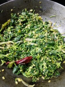 add cooked leaves and moong dal